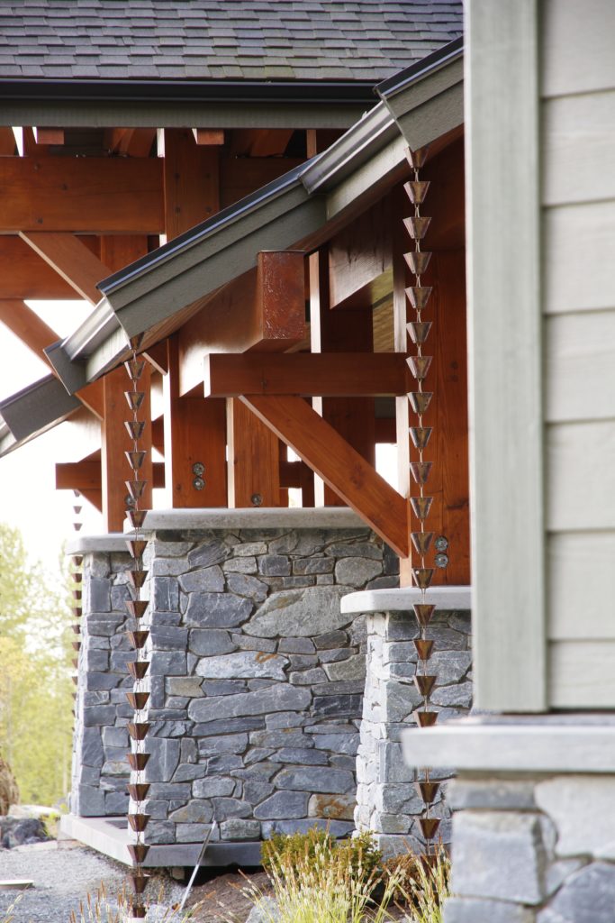 Timber Frame Overhang with Stone Posts